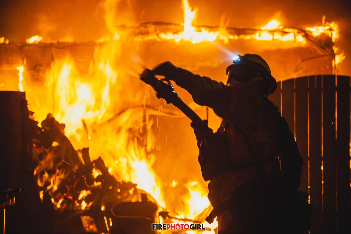 firefighter battles flames Camp Fire